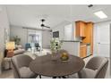 Bright dining area with a round table and chairs, adjacent to the kitchen at 534 Granville Ct, Atlanta, GA 30328