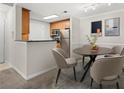 Open concept kitchen and dining area with modern appliances and granite countertops at 534 Granville Ct, Atlanta, GA 30328