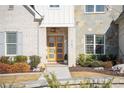 Modern front entrance with double wood doors and brick columns at 1782 Patrick Rd, Dacula, GA 30019