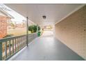 Covered patio with painted brick wall and railing at 3401 Tulip Dr, Decatur, GA 30032