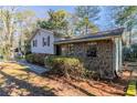 Charming ranch home with stone exterior and landscaping at 8652 Embrey Dr, Jonesboro, GA 30236