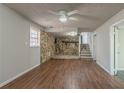 Living room with stone fireplace and hardwood floors at 8652 Embrey Dr, Jonesboro, GA 30236