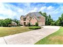Large home with a three car garage and manicured lawn at 1426 Greenridge Trl, Lithonia, GA 30058