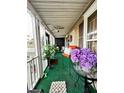 Relaxing screened porch with comfy seating and green flooring at 985 Farrington Se Pl, Atlanta, GA 30315