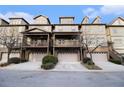 Three story townhomes with attached garages and lush landscaping at 3204 Saute Way, Avondale Estates, GA 30002