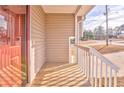 Small wooden front porch with white railings at 108 Ivy Trace Ln, Dallas, GA 30157