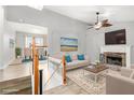 Bright living room features a fireplace and a staircase leading to the upper level at 118 Gilberts Way, Temple, GA 30179