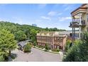 Townhome community with gated entrance and wooded backdrop at 200 River Vista Dr # 606, Atlanta, GA 30339