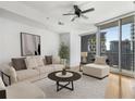 Cozy living room with large windows and natural light; hardwood flooring at 1080 Peachtree Ne St # 1906, Atlanta, GA 30309