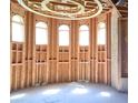 Spacious room with six arched windows and exposed wooden framing, offering abundant natural light at 1628 Golden Creek Sw Ct, Conyers, GA 30094