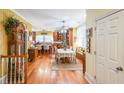 Kitchen features hardwood floors, an island, and a dining area at 9545 Grande Dr, Winston, GA 30187