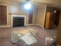 Living room with fireplace and carpet needing replacement at 1759 Bertram Sw Ln, Marietta, GA 30008