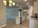 Modern kitchen with island and stainless steel appliances at 3875 Shelleydale Dr, Powder Springs, GA 30127