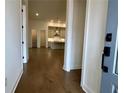 View of the kitchen with stainless steel appliances, hardwood floors, and pendant lighting at 515 Cottage Creek Dr, Cumming, GA 30040
