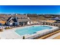 Community clubhouse with large pool, parking lot, and beautiful landscaping at 515 Cottage Creek Dr, Cumming, GA 30040