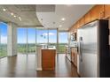 Sleek kitchen featuring stainless steel appliances and wood cabinets at 855 Peachtree Ne St # 2914, Atlanta, GA 30308