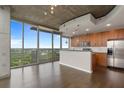Open concept kitchen with island and stainless steel appliances at 855 Peachtree Ne St # 2914, Atlanta, GA 30308