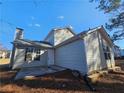 Rear view of house showing patio and gray siding at 10411 Ivygate Ter, Jonesboro, GA 30238