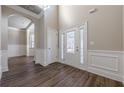 Bright entryway with hardwood floors and neutral paint at 5590 Vickery Cir, Cumming, GA 30040