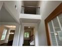 Bright foyer with soaring ceilings and a view of the upper level, creating a grand entrance to the home at 2180 Highridge Point Dr, Lithia Springs, GA 30122