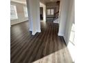 Open living area showcasing lots of natural light, wood floors and elegant columns at 2180 Highridge Point Dr, Lithia Springs, GA 30122