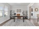 Home office with hardwood floors, built-in shelving and a large window at 515 Paces Dr, Lithia Springs, GA 30122