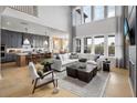 Open floor plan boasts a spacious great room, modern kitchen, and large windows at 6430 Pond View Dr, Cumming, GA 30028