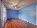 Spacious living room with light wood floors and blue walls at 1533 Harbour Oaks Rd, Tucker, GA 30084