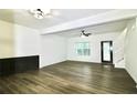 Spacious living room with hardwood floors and a ceiling fan at 2555 Flat Shoals Rd # 3005, South Fulton, GA 30349