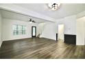 Spacious living room with hardwood floors and a ceiling fan at 2555 Flat Shoals Rd # 3005, South Fulton, GA 30349