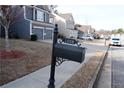 Black mailbox with the number 1008 on a post at 1008 Shadow Glen Dr, Fairburn, GA 30213