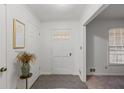 Bright entryway with tiled floor and coat closet at 2343 Meadow Dr, Snellville, GA 30078