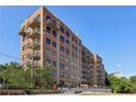 Brick building with multiple balconies and city views at 3235 Roswell Ne Rd # 716, Atlanta, GA 30305