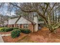 Townhome exterior showcasing a side view and private backyard at 5863 Wintergreen Rd, Norcross, GA 30093