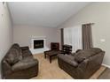 Living room featuring a cozy fireplace and comfortable seating arrangement at 5863 Wintergreen Rd, Norcross, GA 30093