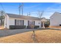 House exterior featuring a well-maintained lawn at 3367 Lineview Dr, Ellenwood, GA 30294