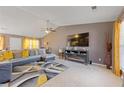 Living room featuring a large TV and electric fireplace at 3367 Lineview Dr, Ellenwood, GA 30294