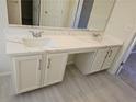 Double vanity bathroom with white cabinets and quartz countertop at 355 Holland Springs Way, Powder Springs, GA 30127