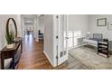 Bright home office with hardwood floors and built-in shelving at 8819 Sibella Ct, Lithia Springs, GA 30122