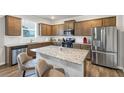 Modern kitchen featuring stainless steel appliances, granite countertops and center island at 8819 Sibella Ct, Lithia Springs, GA 30122