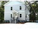 Gray house with a front porch and driveway at 2125 Clay Rd, Austell, GA 30106