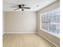 Bright, airy bedroom featuring wood-look floors, neutral paint and ample natural light at 50 Silver Tip Ct, Mcdonough, GA 30253