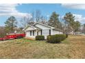 Quaint single-story home with lush front yard landscaping providing a welcoming view at 50 Silver Tip Ct, Mcdonough, GA 30253