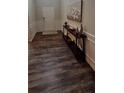 Bright entryway with dark hardwood floors and a console table at 6268 Odum Cir, Covington, GA 30014