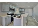 Modern kitchen featuring stainless steel appliances and an island at 2422 Tiffany Cir, Decatur, GA 30035
