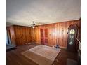 Spacious living area with wood paneled walls at 2104 Cascade Sw Rd, Atlanta, GA 30311