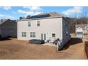 Backyard with a patio, lawn, and solar panels on the roof of the house at 2527 Dayview Ln, Atlanta, GA 30331