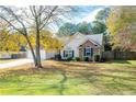 Two-story house with stone accents, a two-car garage, and a spacious yard at 117 Javay Ct, Villa Rica, GA 30180