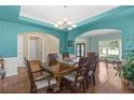 Formal dining room with hardwood floors and a large table at 6519 Cheval Ct, Stone Mountain, GA 30087