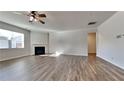 Living room with hardwood floors, fireplace and ceiling fan at 2810 Torunn Ct, Atlanta, GA 30331